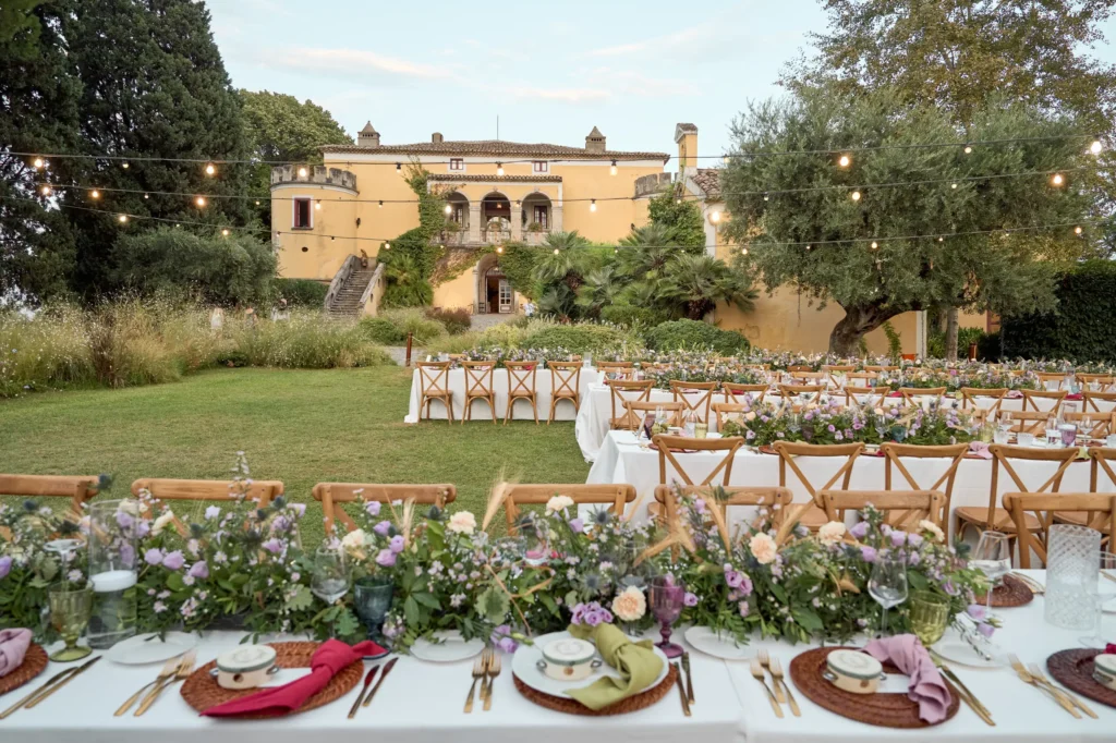 Serragiumenta Castle with outdoor decorated tables for the wedding of Larissa and Luca.